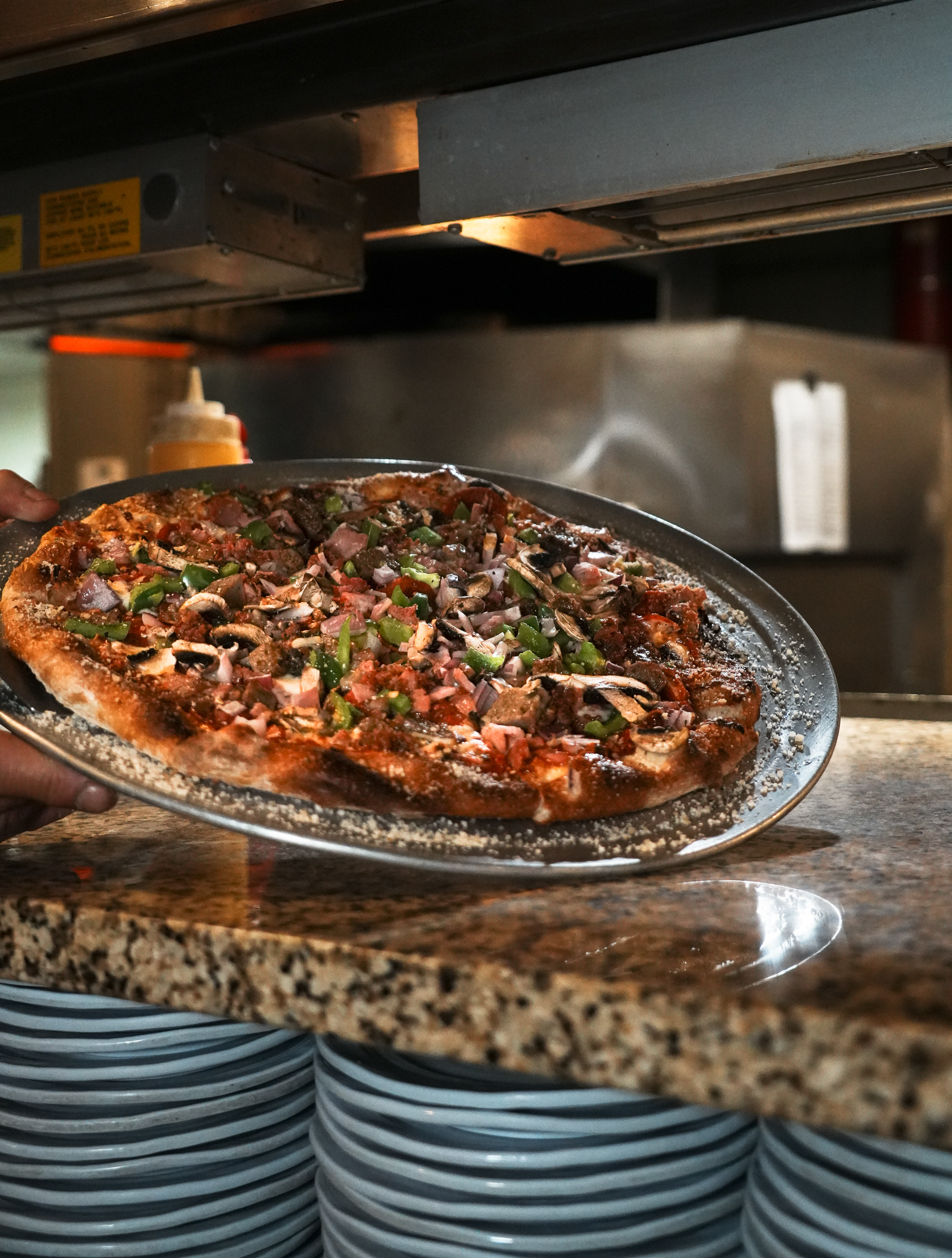 Photo of one of Tony V’s delicious pizzas taken by Kira Gendjar.